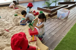 Maplebear Norwest Senior Bears playing in sandpit